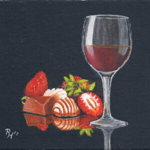 Stillleben mit Erdbeeren, Pralinen und einem Glas Rotwein